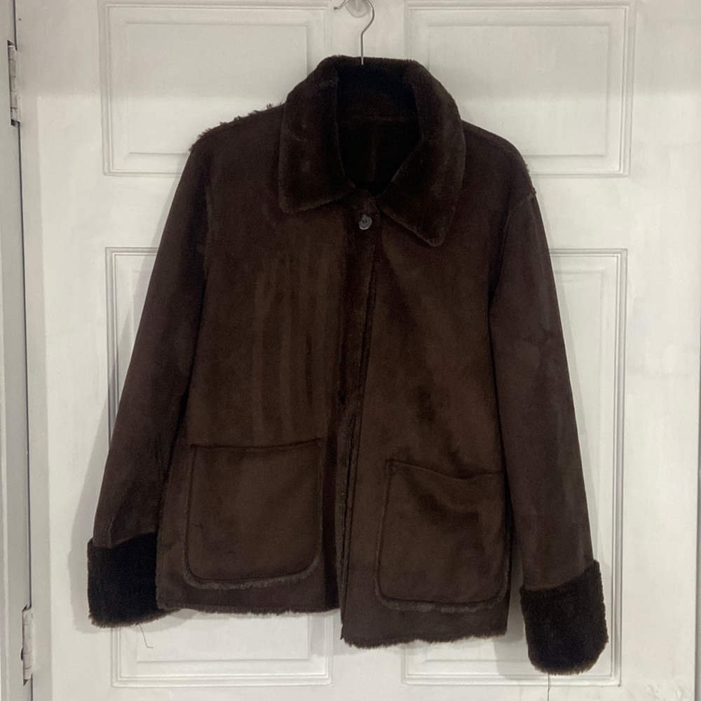 Brand new brown jacket with fur inside.